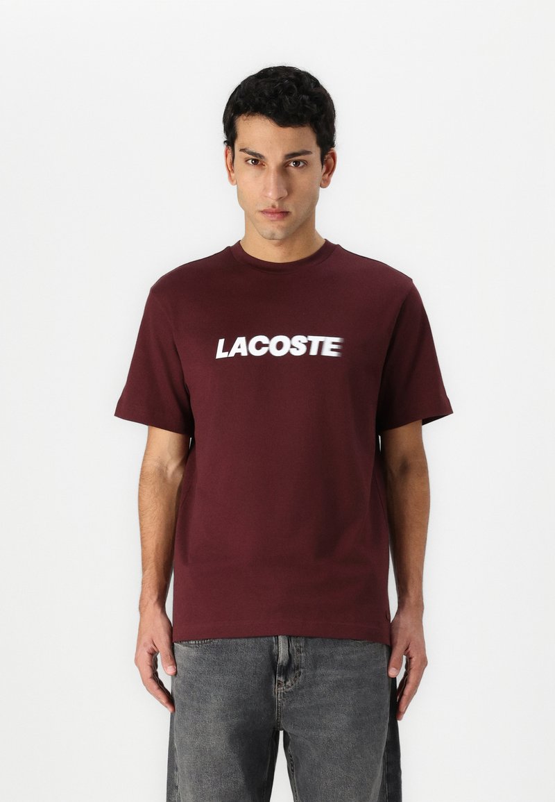 Lacoste Marškinėliai su spaudiniu - expresso