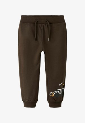 Hnedé detské tepláky s elastickým pásom a manžetami, s malou ilustráciou rýpadla na spodnej časti nohy.