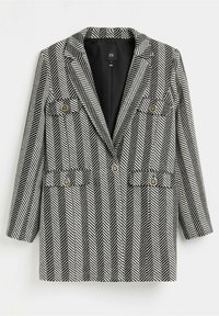Blazer s kostkovaným vzorem houndstooth v černé a bílé barvě, s přizpůsobeným střihem, klopovými límci a dvouřadým zapínáním se zlatými knoflíky.