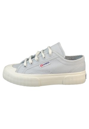 Light gray canvas sneaker with a rounded toe, rubber sole, and white laces. Features embossed texture and a small logo on the side.