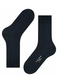Calcetines de rayas en color navy, fabricados en un material suave con el tobillo y la puntera reforzados. Presentan el logotipo de la marca en color blanco en la suela.
