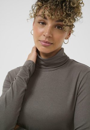 Harmaa pitkähihainen turtleneck-paita, jossa on riipputekstuuri. Ominaisuuksiin kuuluu korkea kaulus ja hyvin istuvat hihat, korostettuna pehmeällä materiaalilla.