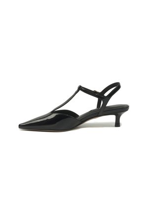 Black patent leather slingback kitten heel shoe with pointed toe and T-strap design on a white background.