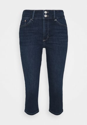 Dark blue denim jeans with a high waist, featuring two silver buttons, five pockets, and a cropped hem. Texture is smooth with slight stretch.