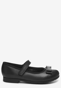Ballerines en cuir noir avec un bout arrondi, une bride élastique et un nœud décoratif sur le devant. Texture lisse et détails minimalistes.