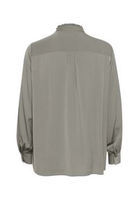 Blusa a maniche lunghe in morbido tessuto grigio chiaro con colletto arricciato, retro plissettato e polsini con bottoni, caratterizzata da una vestibilità rilassata.