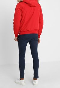 Tommy Jeans Giacca da mezza stagione - light red