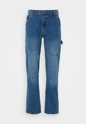 Blue denim pants with a straight leg design, featuring seam detailing and a button closure. Fabric shows a faded wash with a smooth texture.