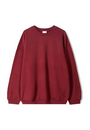 Sweatshirt bordeaux avec une coupe décontractée, doté d'un col rond et de manches tombantes, présenté sur un fond blanc uni.