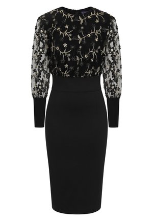Zwarte jurk met een aansluitende pasvorm, doorschijnende geborduurde mouwen met bloemmotieven en een ronde halslijn met een discreet rits aan de achterkant.
