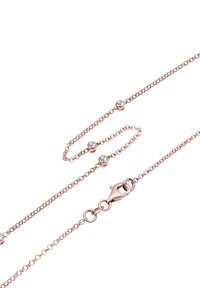 Rose gold kæderekæde med små, runde, klare krystaller fordelt langs længden, med en lobster clasp lukning.