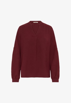 Burgundowa bluzka z długim rękawem i dekoltem w serek, zebranymi mankietami i luźnym krojem, wykonana z teksturowanej tkaniny. Prosty i minimalistyczny design.
