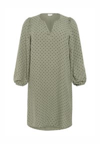 Robe verte avec des manches longues et bouffantes, dotée d'un décolleté en V et de pois noirs. Fabriquée en tissu léger avec une coupe décontractée.