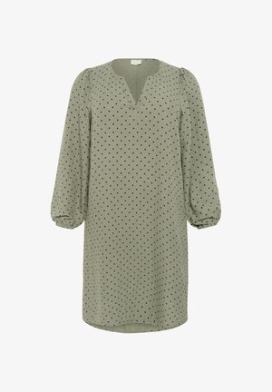 Roheline kleit pikkade, põrutatud varrukatega, millel on V-kujuline kaelus ja mustad täpid. Valmistatud kergest kangast, millel on lõdva lõikega disain.