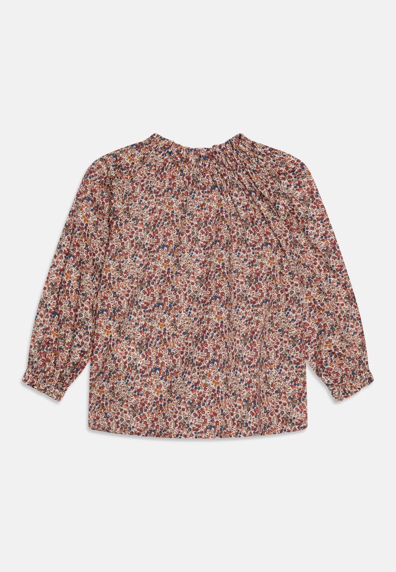 Blouse à manches longues avec un motif floral rose, rouge, bleu et jaune, col rond froncé et poignets élastiques.