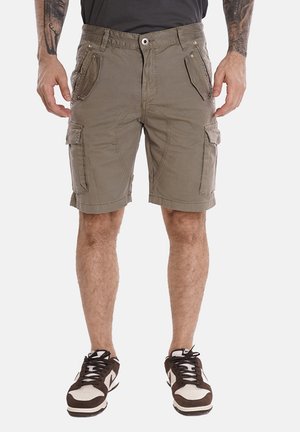 Pantaloni cargo di colore verde oliva, realizzati in misto cotone. Caratterizzati da molteplici tasche, passanti per cintura e chiusura con zip. Tessuto texturizzato con una vestibilità comoda.