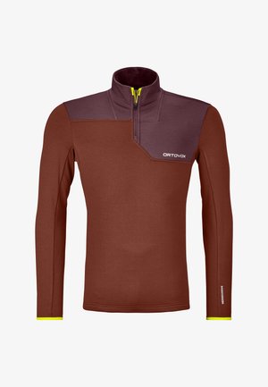 Braunes Fleece-Pullover mit langen Ärmeln und hohem Kragen, ausgestattet mit einem dunkelbraunen Einsatz, gelbem Reißverschluss und Logo auf der Brust. Glatte Textur.