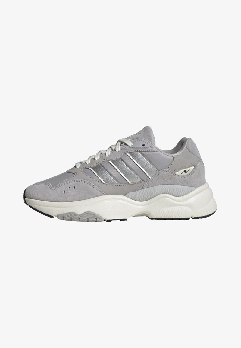 Gray and white Adidas sneaker with silver stripes, thick cushioned sole, and suede and mesh upper, shown in side profile.