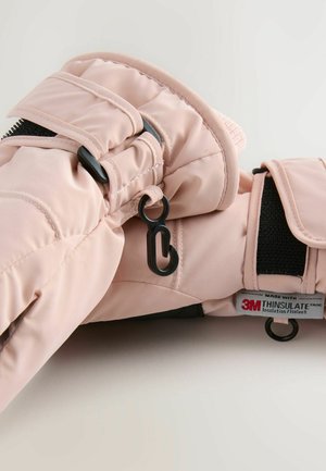 Rosa isolerade handskar med ett kviltat mönster, som har svarta kardborreband, krokar och en etikett som indikerar 3M Thinsulate-isolering.