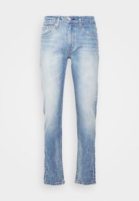 Light blue denim jeans with a relaxed fit, faded texture, five pockets, and a straight leg design. Features a button and zipper closure.