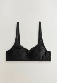 Soutien-gorge en dentelle noire avec fines bretelles réglables, bonnets avec armatures et un petit nœud décoratif au centre devant.