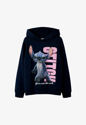 Marineblauwe hoodie met een afbeelding van een personage met grote oren en ogen; tekst "STITCH" en "You're outta this world" in roze.