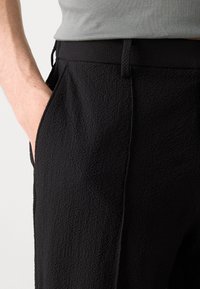 Calvin Klein PULL ON - Trousers - black
