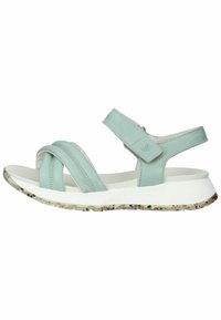 Sandali in pelle azzurro chiaro con cinturini incrociati, cinturino regolabile alla caviglia, intersuola bianca con texture e suola trasparente maculata.