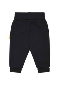 Schwarze Sweatpants aus Baumwolle mit elastischem Bund, gerippten Knöcheln und einem kleinen Etikett auf der linken Seite. Glatte Textur, einfaches Design.