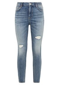 Ljust blå slim-fit jeans med slitna fläckar ovanför båda låren, femfickorsdesign och knäppning.