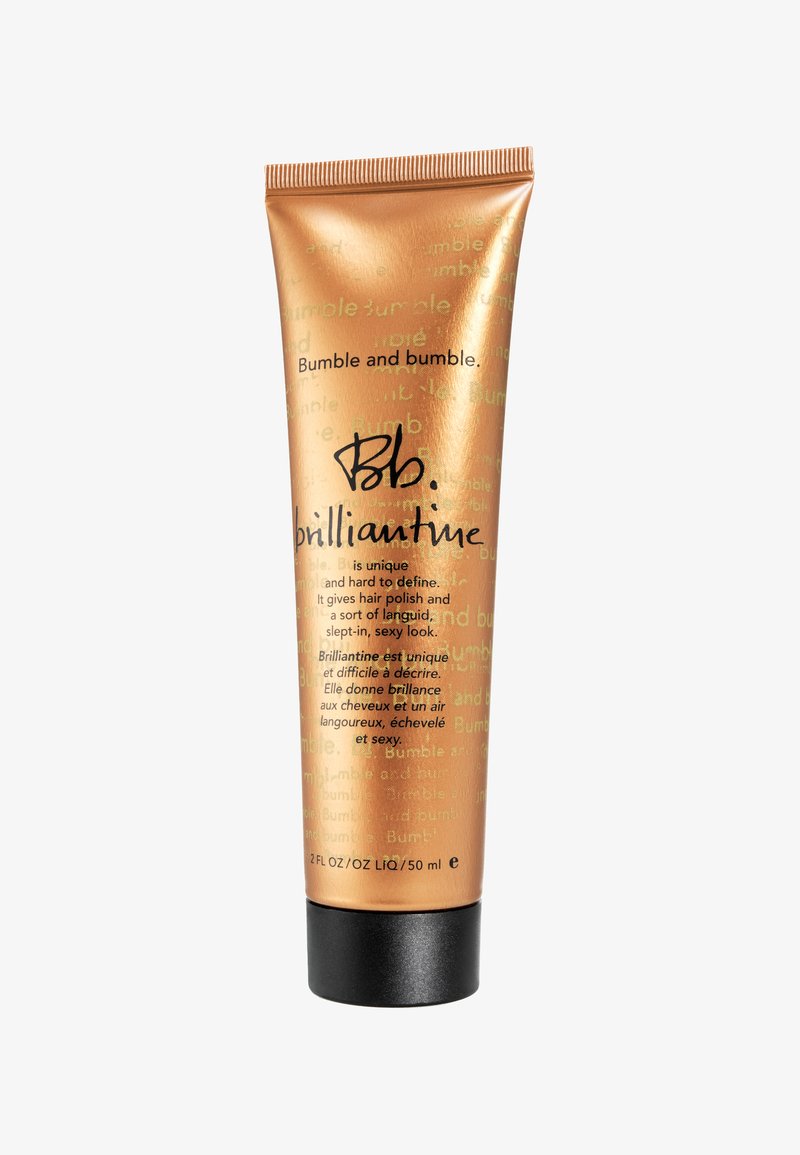 Guld, metallisk klämtube med svart bas, med svart skrifttext. Innehåller 2 FL OZ av Bumble and bumble. brilliantine hårprodukt.