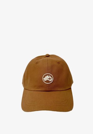 Gorra de béisbol de algodón marrón con visera curvada, que presenta un logotipo circular blanco con un mapa y un detalle de cruz en la parte delantera. Tejido texturizado.