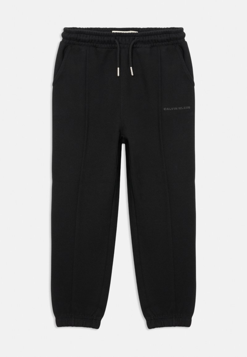 Black sweatpants made of soft fabric with an elastic waistband, side pockets, and cuffed ankles. Features a subtle logo on one side.