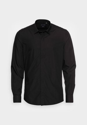 Camicia nera a maniche lunghe con bottoni realizzata in tessuto morbido. Presenta un colletto, un'apertura frontale con bottoni e una vestibilità aderente.