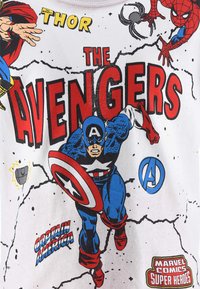 White T-shirt featuring colorful comic book graphics of Marvel characters, including Captain America, Thor, and Spider-Man, with bold text.