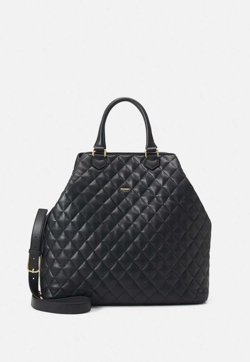 Black quilted handbag made of textured material, featuring rounded handles, a detachable shoulder strap, and gold hardware accents.