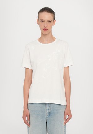 White cotton t-shirt with a round neckline, short sleeves, and subtle floral embroidery in tonal thread on the front.