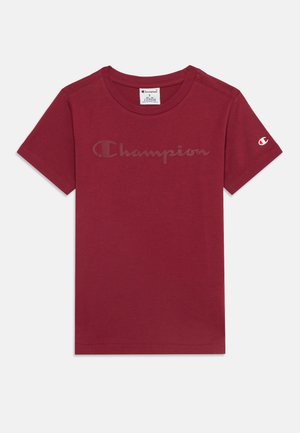 T-shirt Champion bordeaux à manches courtes avec un col rond, texte discret du logo sur la poitrine et petit logo sur la manche gauche.