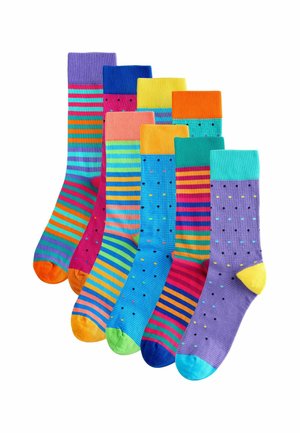 Súprava siedmich ponožiek v živých farbách. Obsahuje pruhy a bodky. Materiály vyzerajú rebrovane s kontrastnými špičkami a lemy.