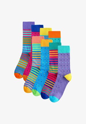 Set aus sieben Socken in lebhaften Farben. Inklusive Streifen und Punkten. Materialien scheinen gerippt zu sein mit kontrastierenden Zehen- und Bündchenakzenten.