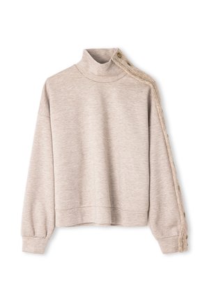 Sweat-shirt beige clair à col cheminée, bordure texturée sur une manche, et détails de boutons. Tissu doux, coupe courte.