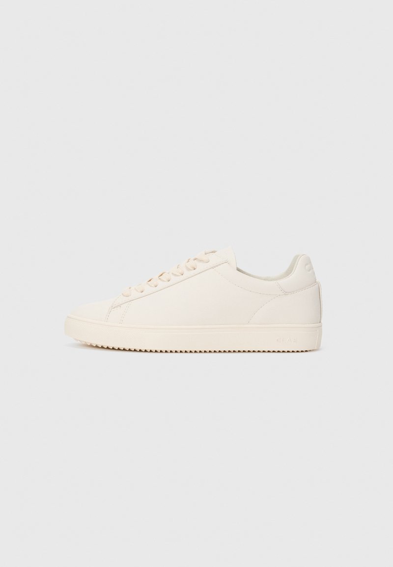 Low-top off-white sneaker with lace-up closure and ridged sole, shown in side profile on plain light background.