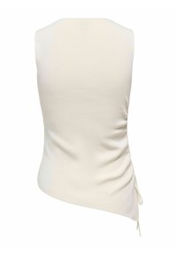 Haut en maille ivoire sans manches avec un ourlet asymétrique et un détail cordon sur le côté, vu de dos sur fond blanc.