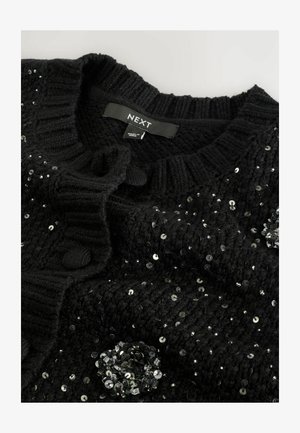 Schwarze Strickjacke aus strukturiertem Stoff, runder Ausschnitt, Knopfverschluss und mit Pailetten verziert. Markenlabel sichtbar.