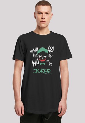 Black t-shirt featuring a graphic of the Joker's face with green hair, red mouth, and white features, alongside "JOKER" in green text.