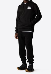 The North Face Jersey con capucha - black