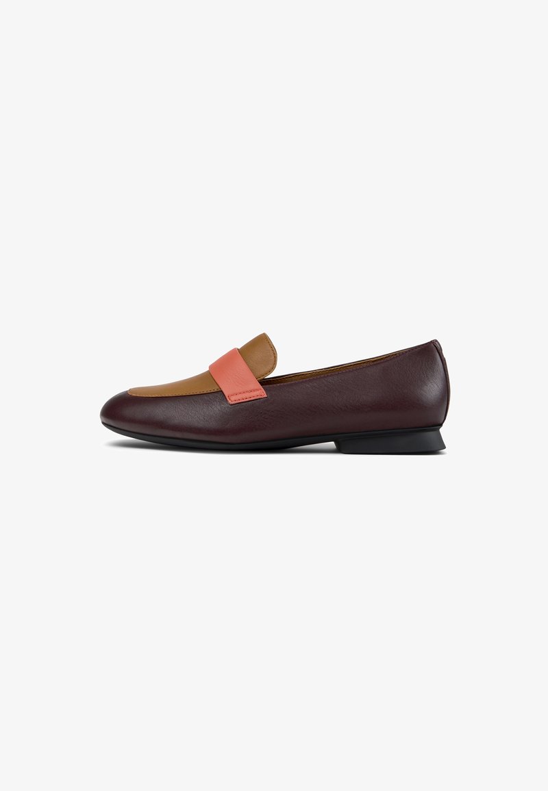 Burgundy leather loafers with a tan and pink accent strap. Low heel, smooth texture, and rounded toe design.