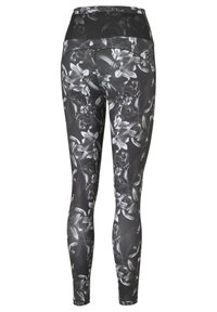 Leggings floreali in bianco e nero con vita alta, realizzati in un tessuto liscio e elastico, dotati di una vestibilità aderente, adatti per l'abbigliamento sportivo.