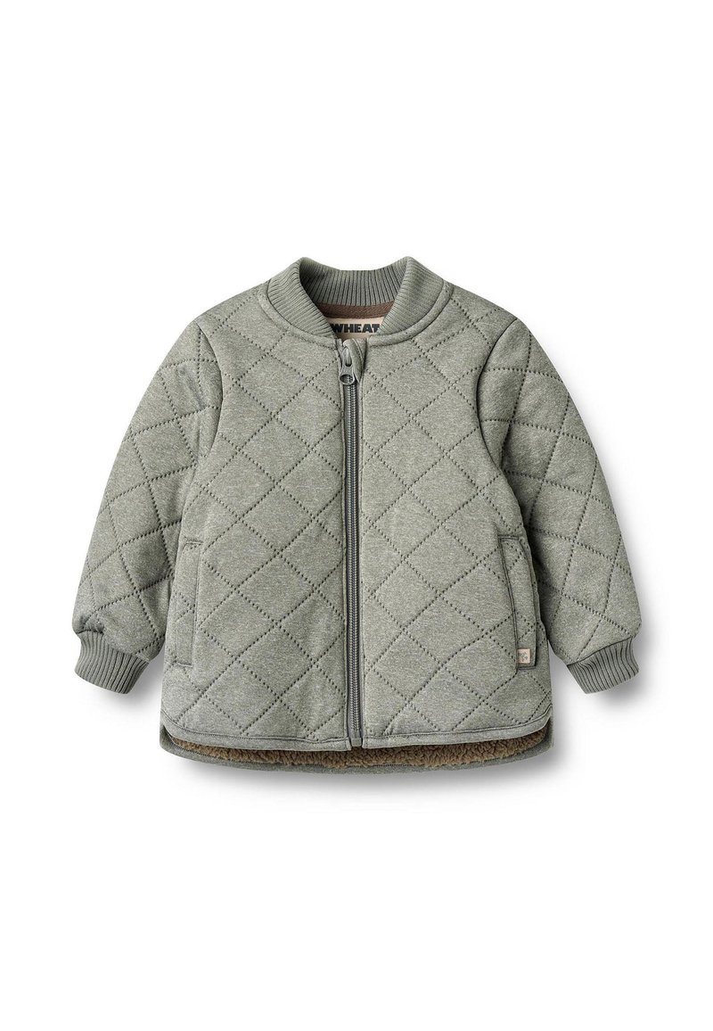 Grøn quiltet jakke med lynlås foran, ribbet krave og manchetter. Har sidelommer og teksturerede detaljer i diamantmønster.