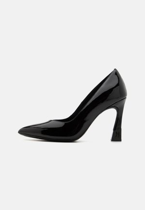 Black patent leather high heel pump with a pointed toe and a block heel featuring a logo accent. Smooth, shiny surface texture.